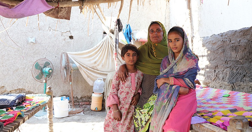 Woman and two girls in a shelter in Pakistan